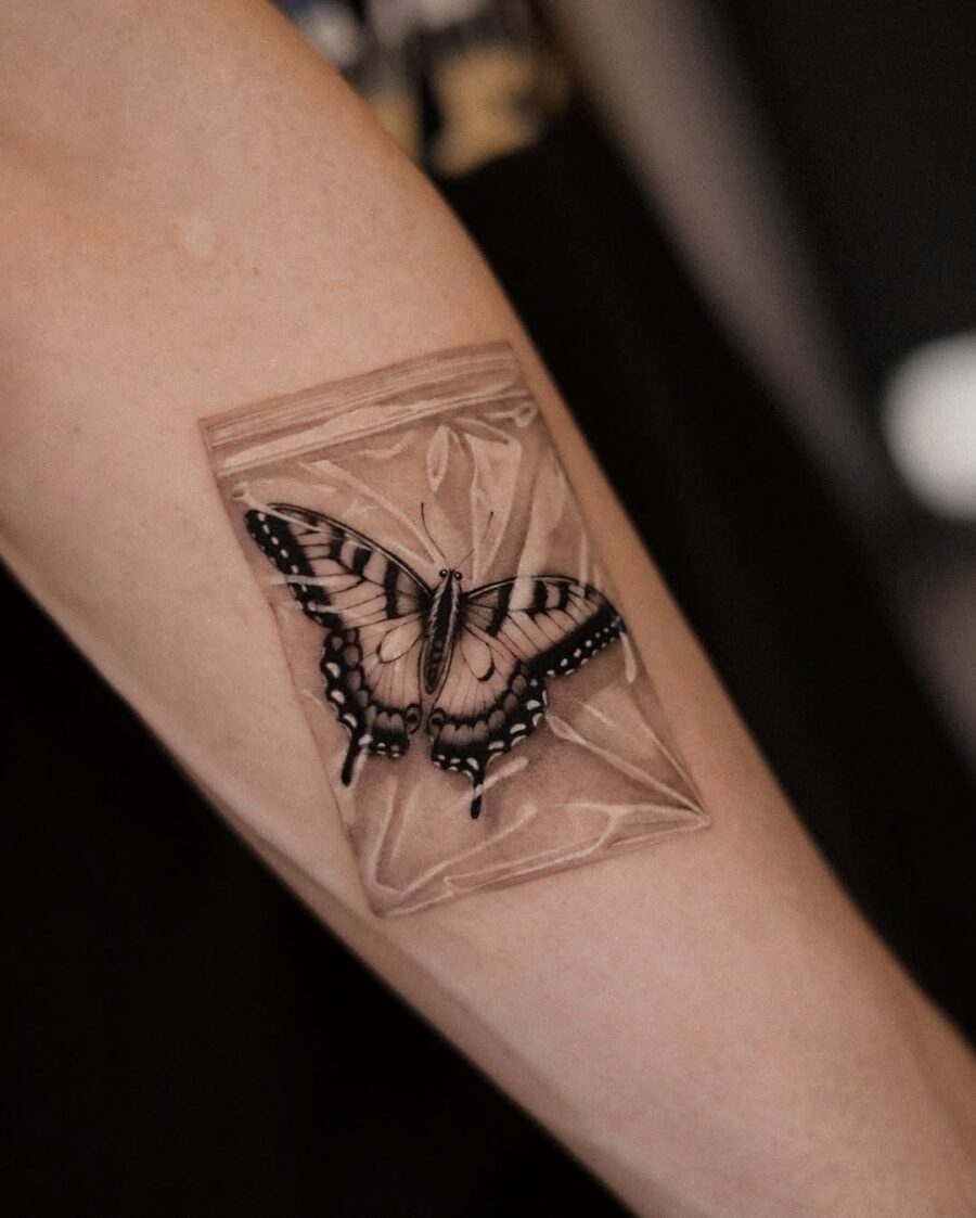 Intricate butterfly tattoo in a bag design Tattoo on skin