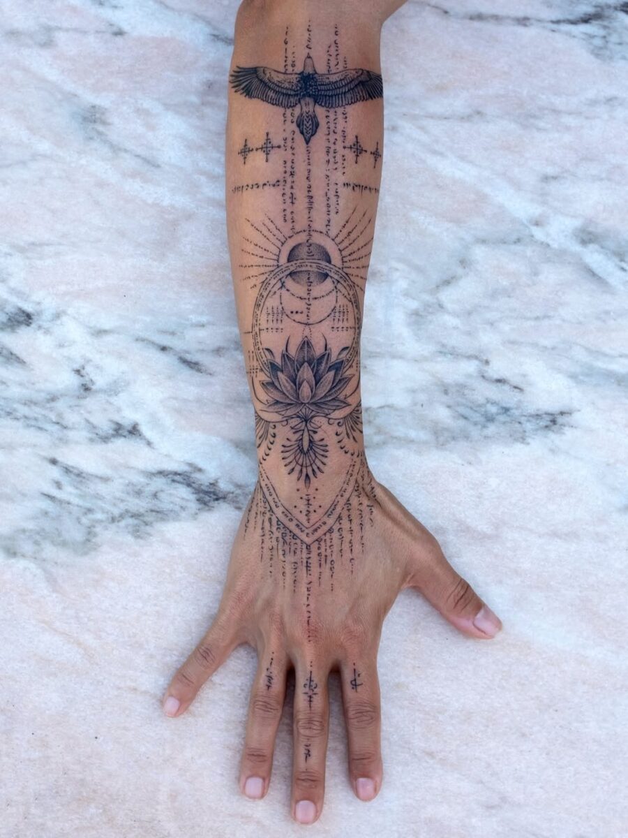 Intricate geometric lotus with celestial accents Tattoo on skin