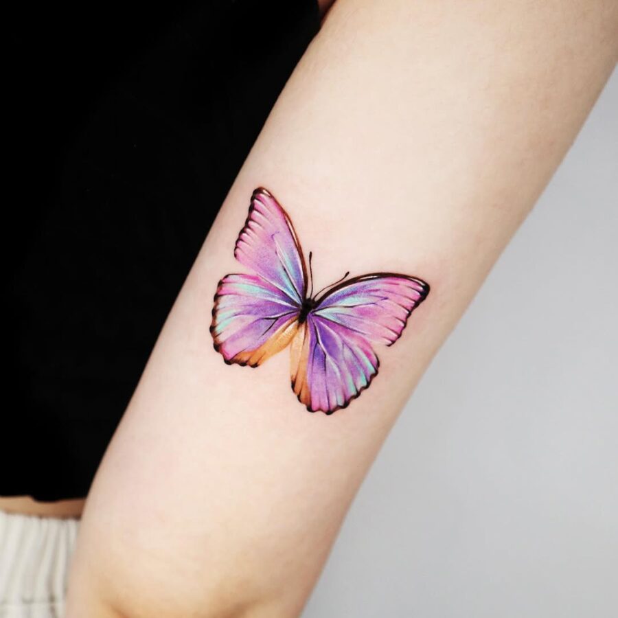 Stunning butterfly tattoo in vibrant colors Tattoo on skin