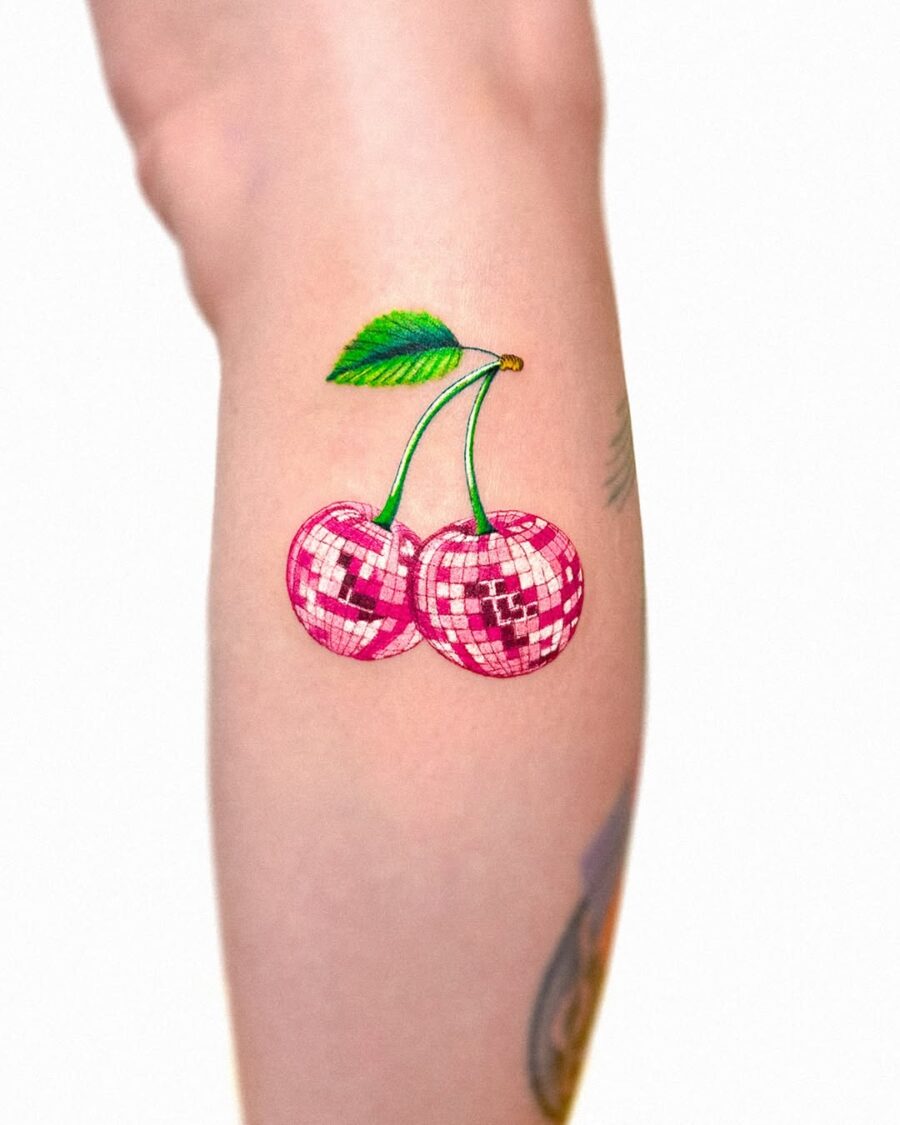 Vibrant Cherry Tattoo with Disco Vibes Tattoo on skin