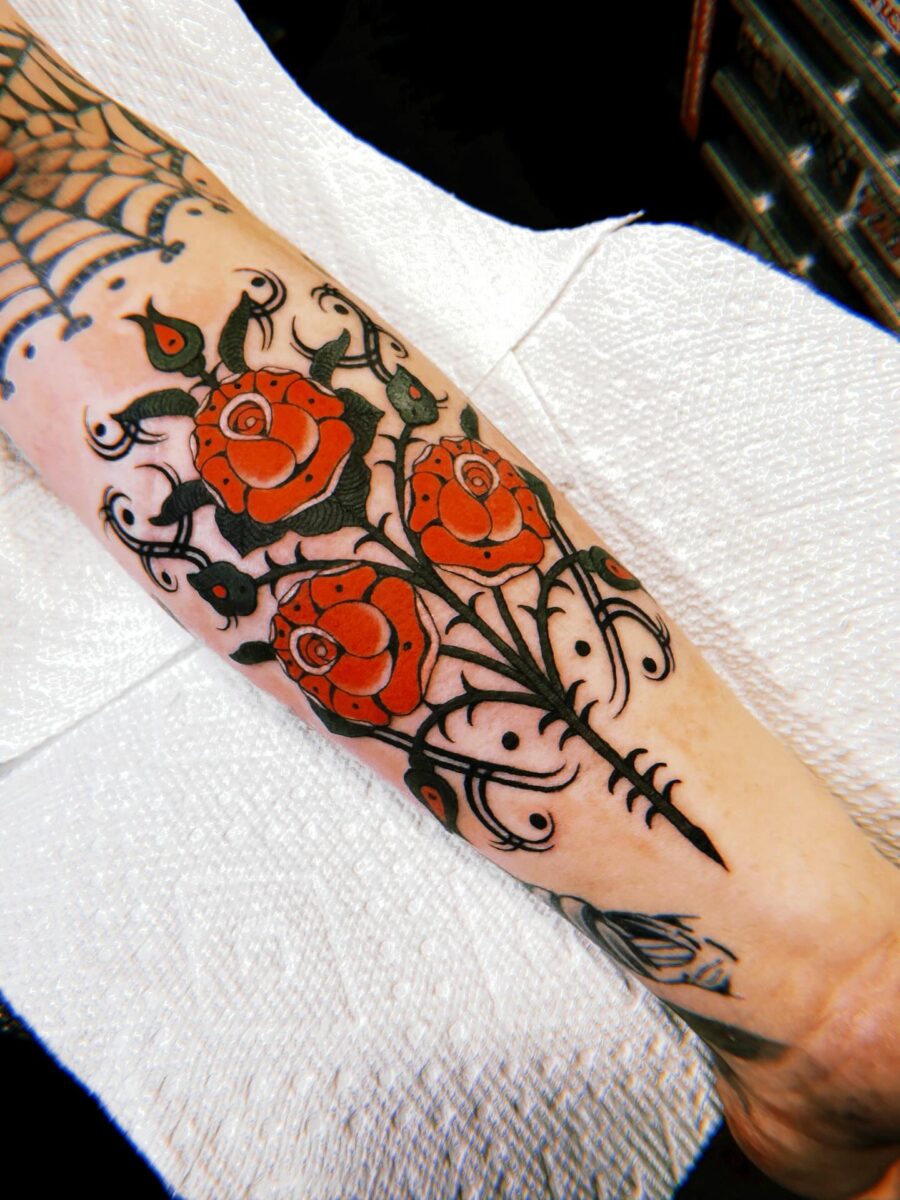 Vibrant Americana roses with intricate designs Tattoo on skin