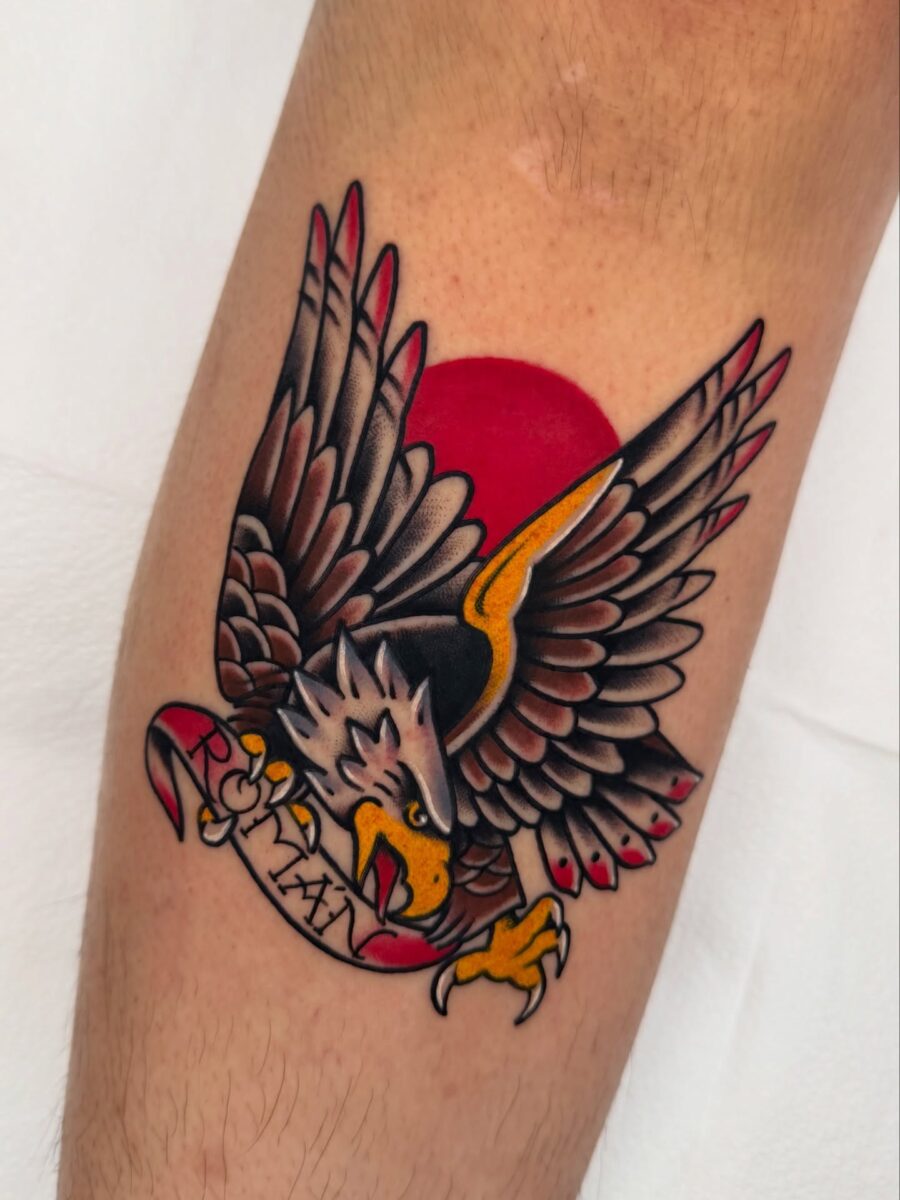 Vibrant eagle tattoo with sunset background Tattoo on skin
