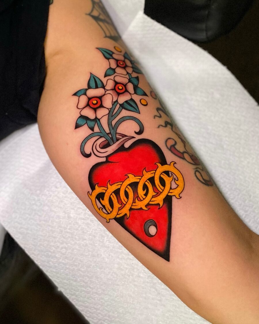 Vibrant flower heart tattoo with chain design americana tattoos