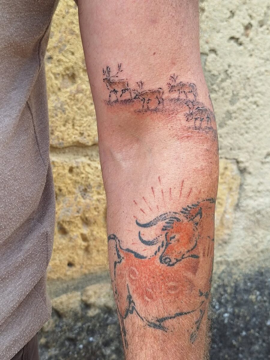 Captivating ancient bull tattoo design on arm Tattoo on skin