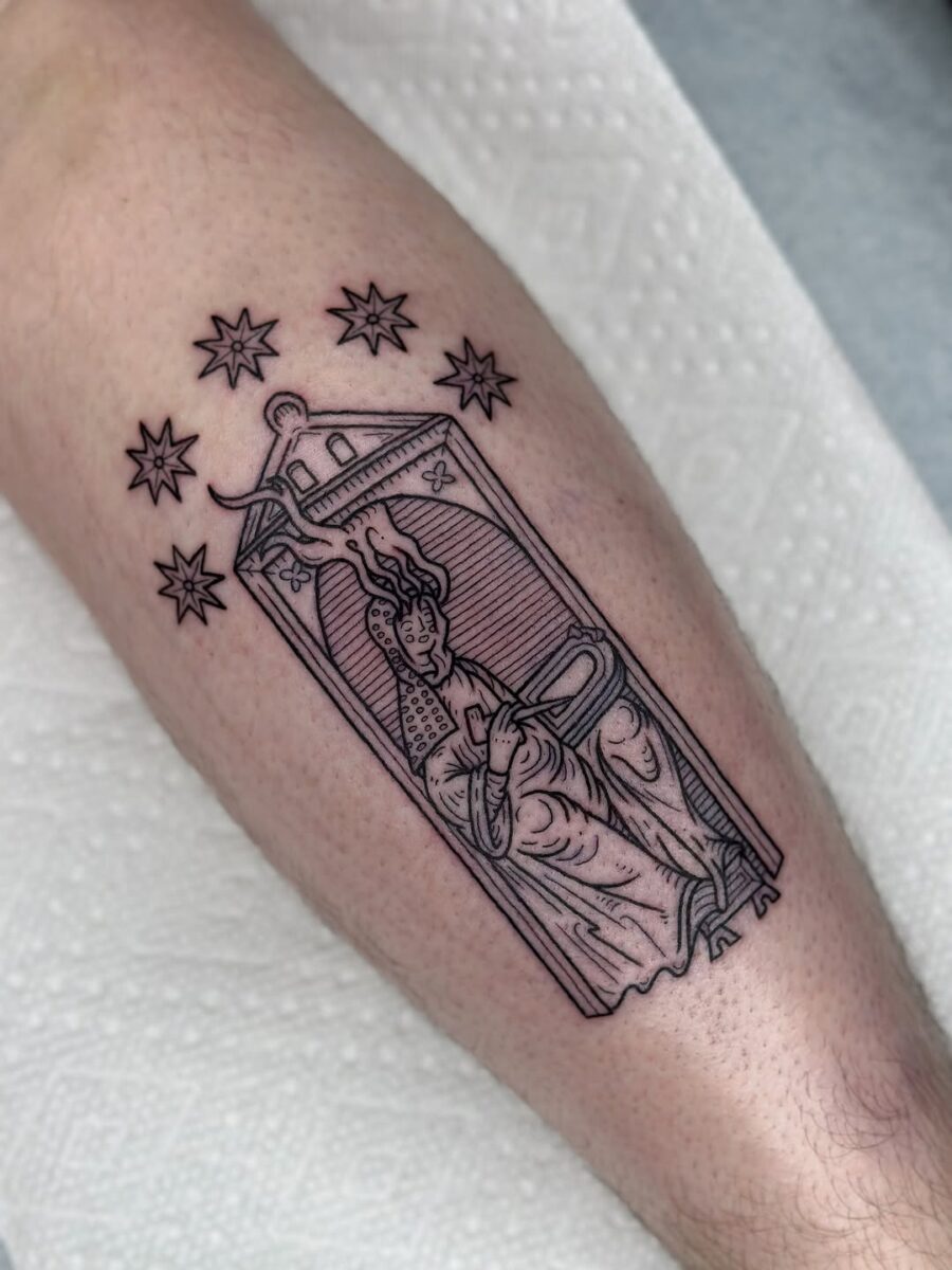 Intricate depiction of a revered figure in ink Tattoo on skin