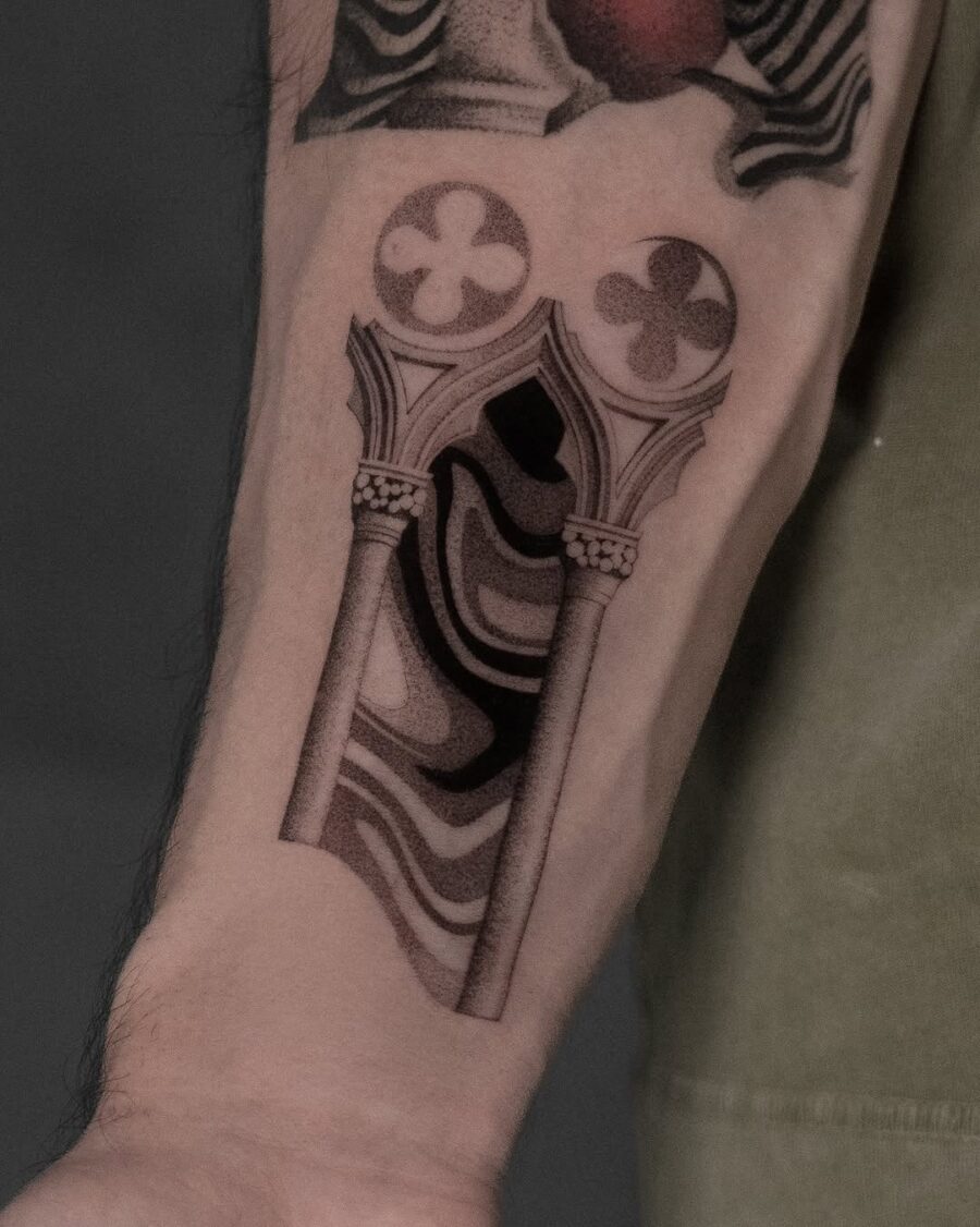 Intricate design of an ancient architectural feature. Tattoo on skin
