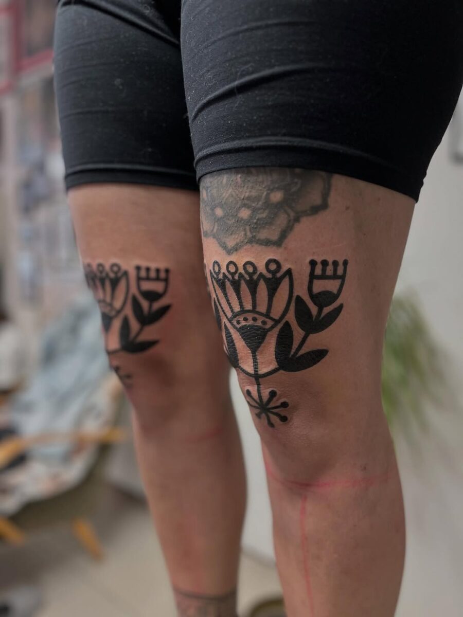 Intricate floral tattoos adorning the thighs Tattoo on skin