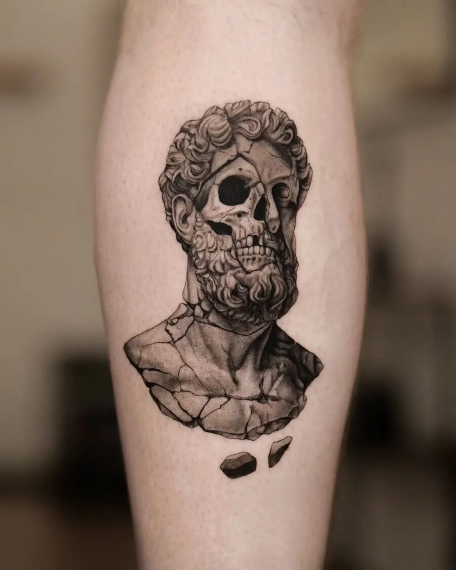 Intricate skull tattoo of an ancient bust Tattoo on skin