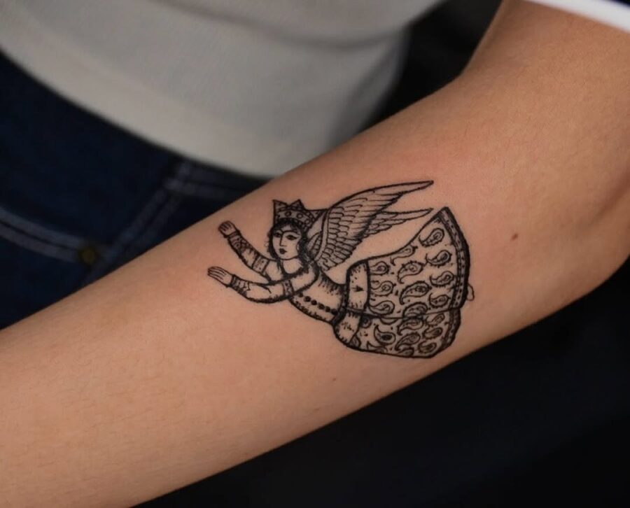 Intricate vintage angel tattoo with details Tattoo on skin