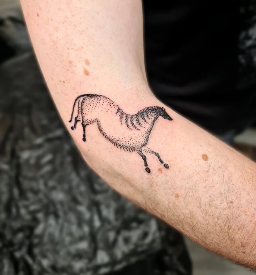 Stylized horse tattoo using dotted technique Tattoo on skin