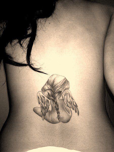 Cute Baby Small Angel Tattoo on Lower Back Tattoo on skin