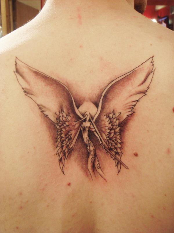 Cute Fairy Angel Tattoo Design Placed Between Shoulder Blades For Women Tattoo on skin