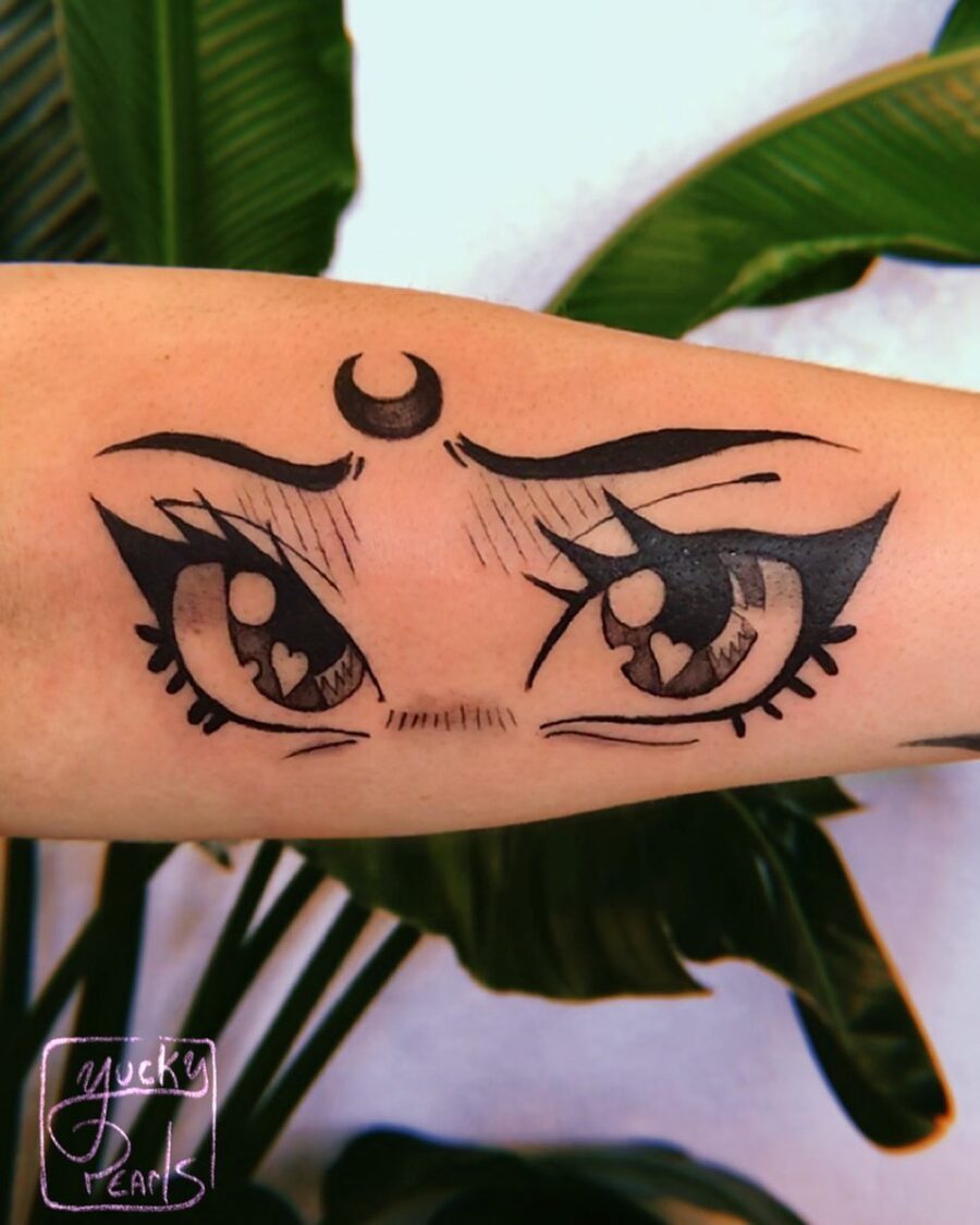 Charming anime eyes tattoo with heart details Tattoo on skin