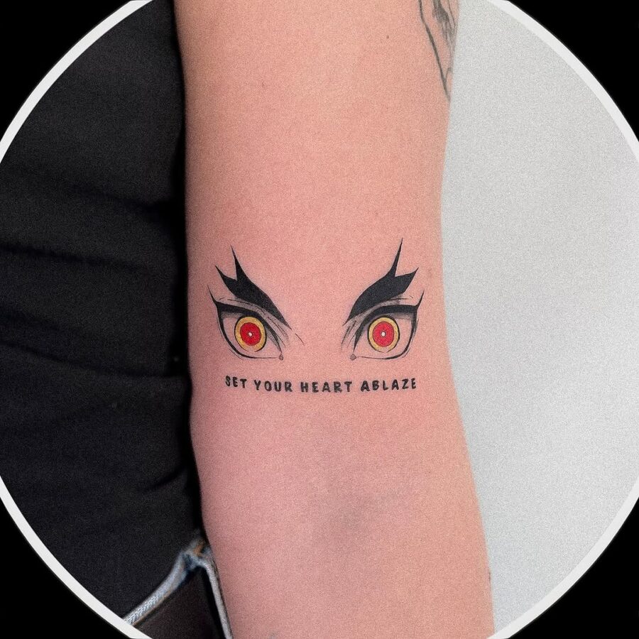 Dynamic anime eyes inked with impactful phrase Tattoo on skin