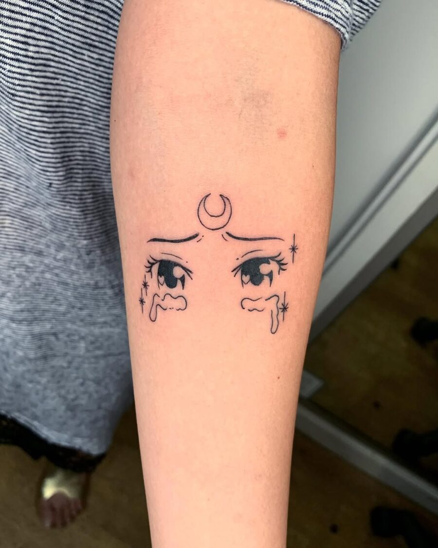 Emotional anime eyes with celestial accents Tattoo on skin