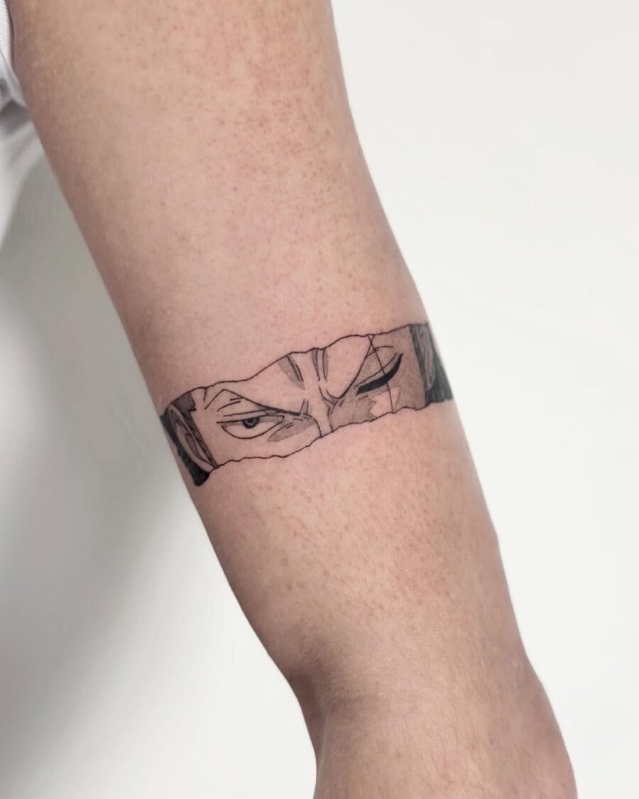 Striking anime eyes tattoo on the arm Tattoo on skin