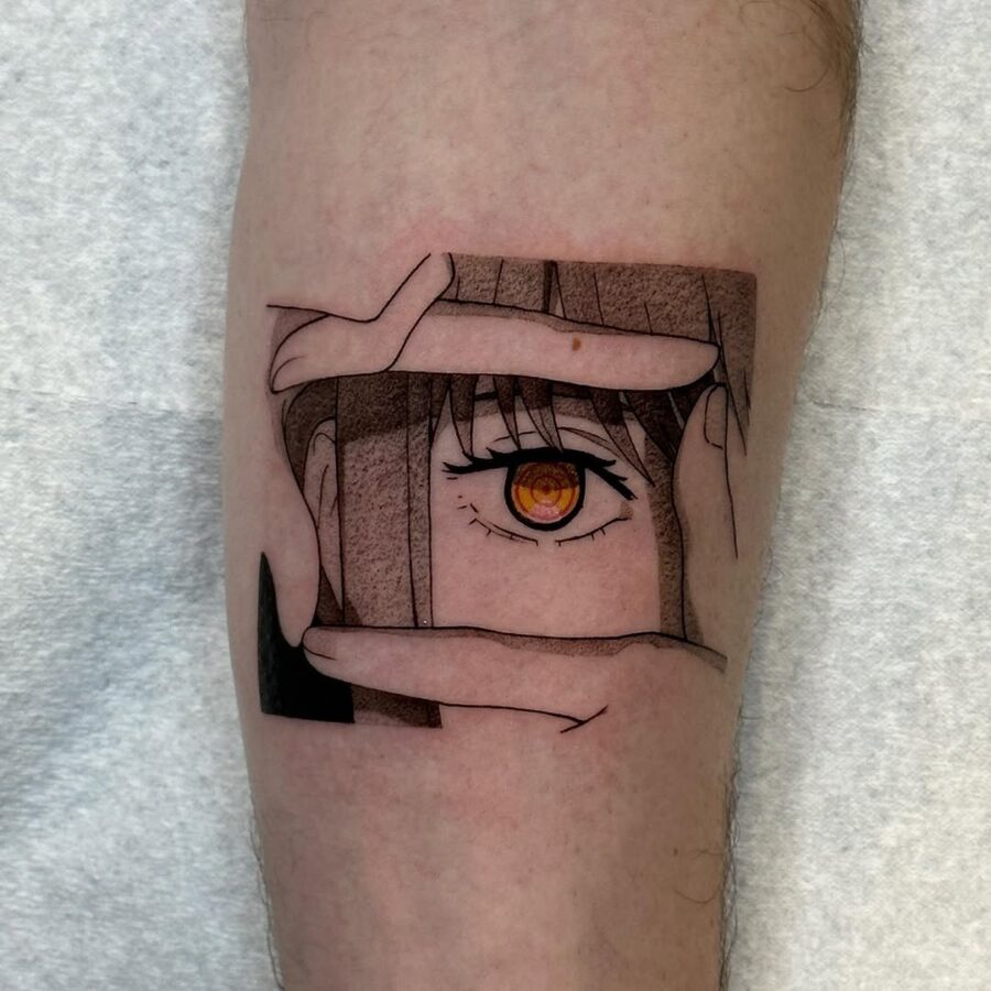 Unique anime eye tattoo with framing hands. Tattoo on skin