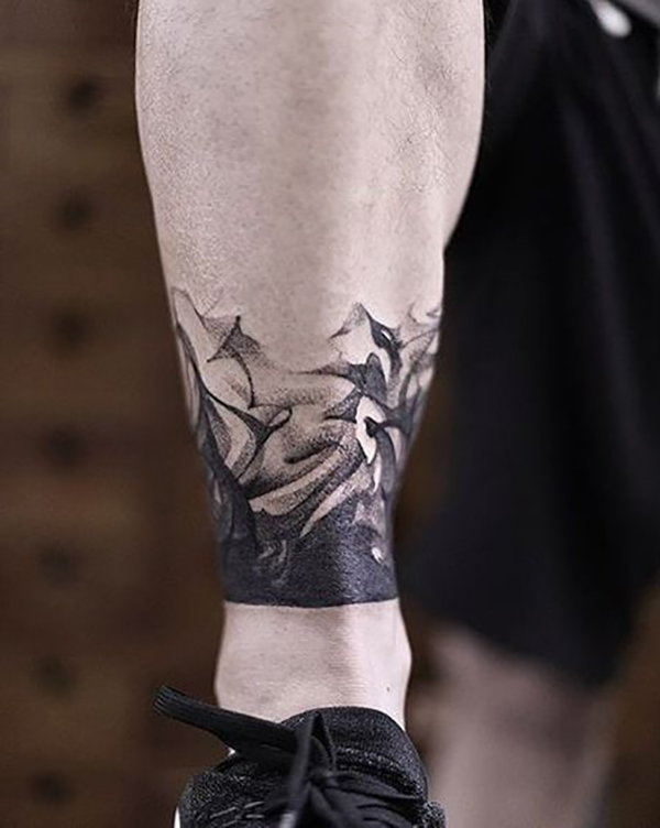 Delicate Swirls of Black Rising Leg ankle tattoos for Various Skin Tones Tattoo on skin