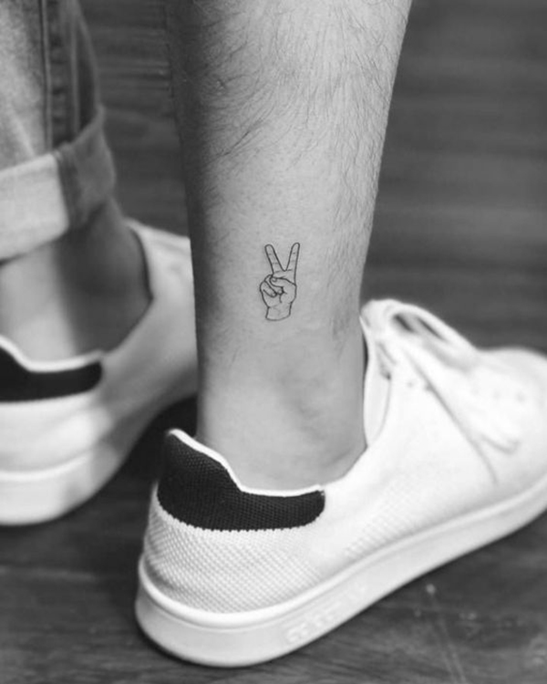 Tiny Hand Holding Up Two Fingers ankle tattoos by tattoo shop Tattoo on skin