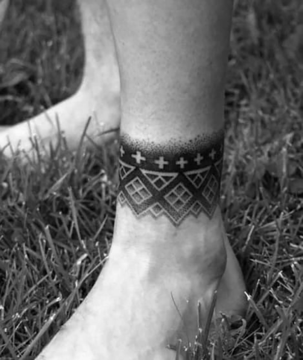 Small Gray Wings Sprouting From Ankle ankle tattoos