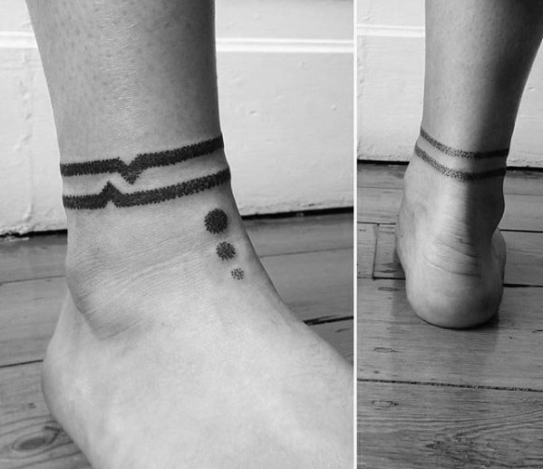 Two Indented Lines and Dots Tattoo on skin