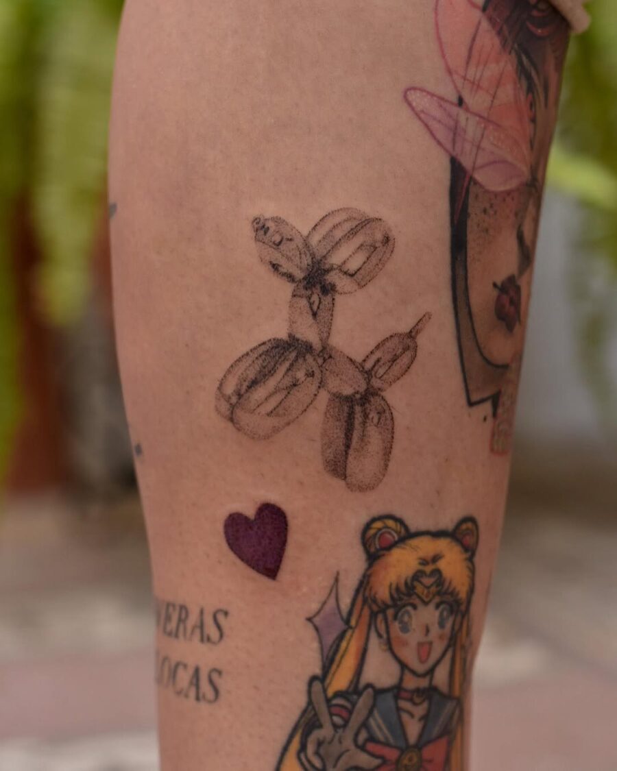 Charming balloon dog tattoo on tattooed leg Tattoo on skin