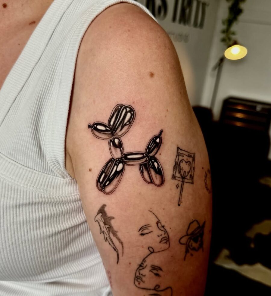 Charming minimalist balloon dog tattoo design Tattoo on skin
