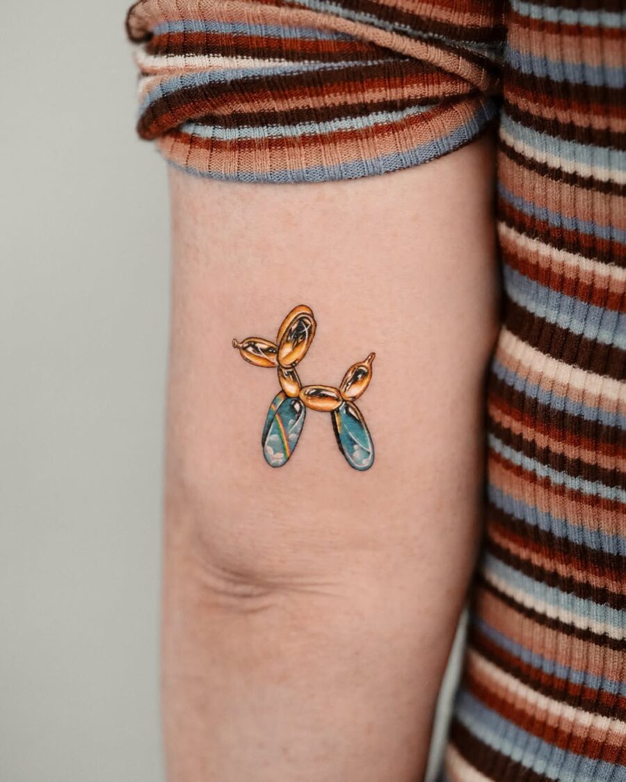 Colorful balloon dog tattoo with artistic flair Tattoo on skin
