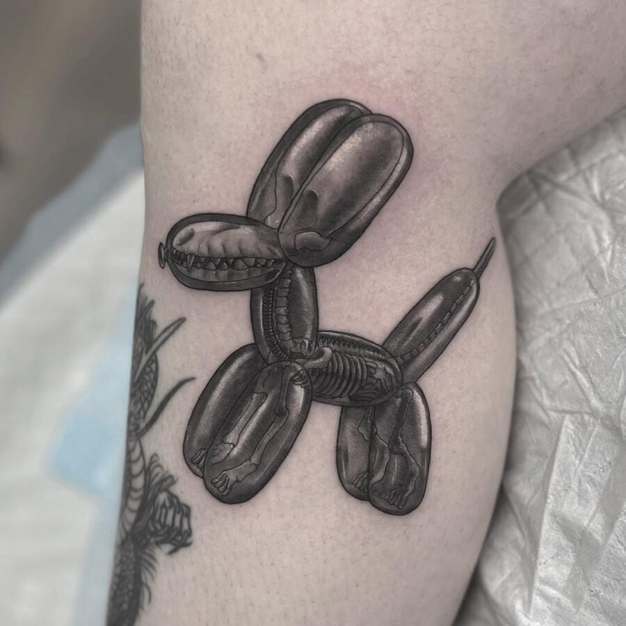 Realistic balloon dog tattoo with intricate details Tattoo on skin