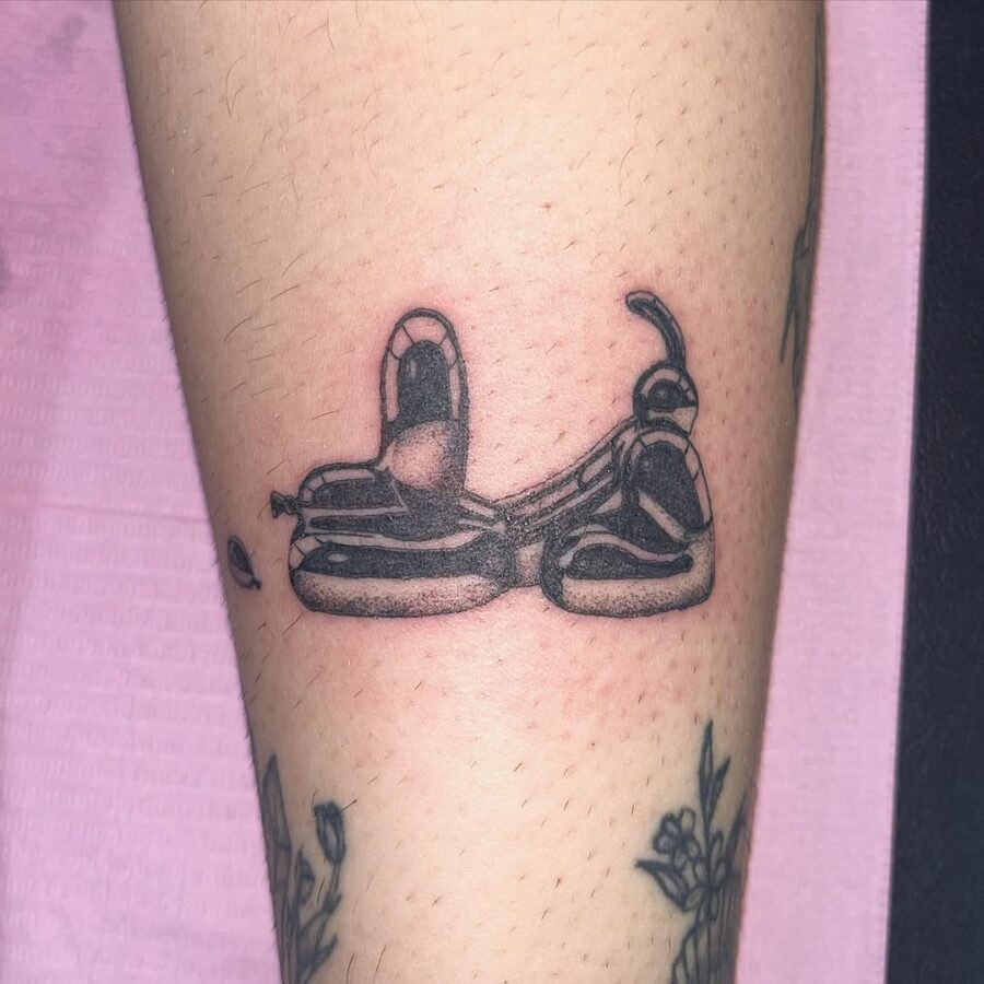 Unique balloon dog tattoo with intricate detailing Tattoo on skin