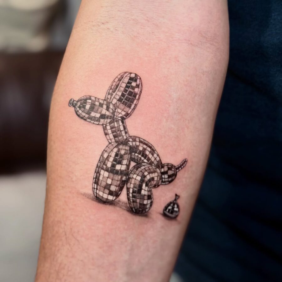 Unique checkered balloon dog tattoo design Tattoo on skin
