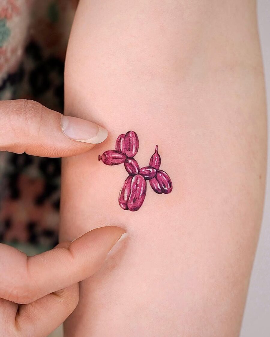 Unique purple balloon dog tattoo design on skin Tattoo on skin