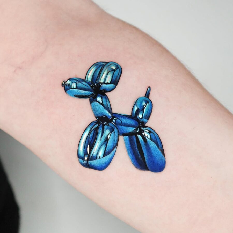 Vibrant Balloon Dog Tattoo in Glossy Blue Tattoo on skin