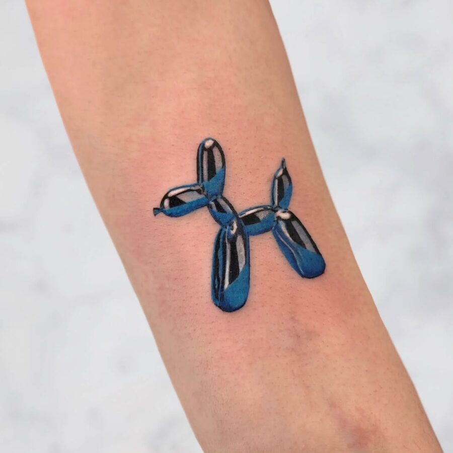 Vibrant blue balloon dog tattoo design Tattoo on skin