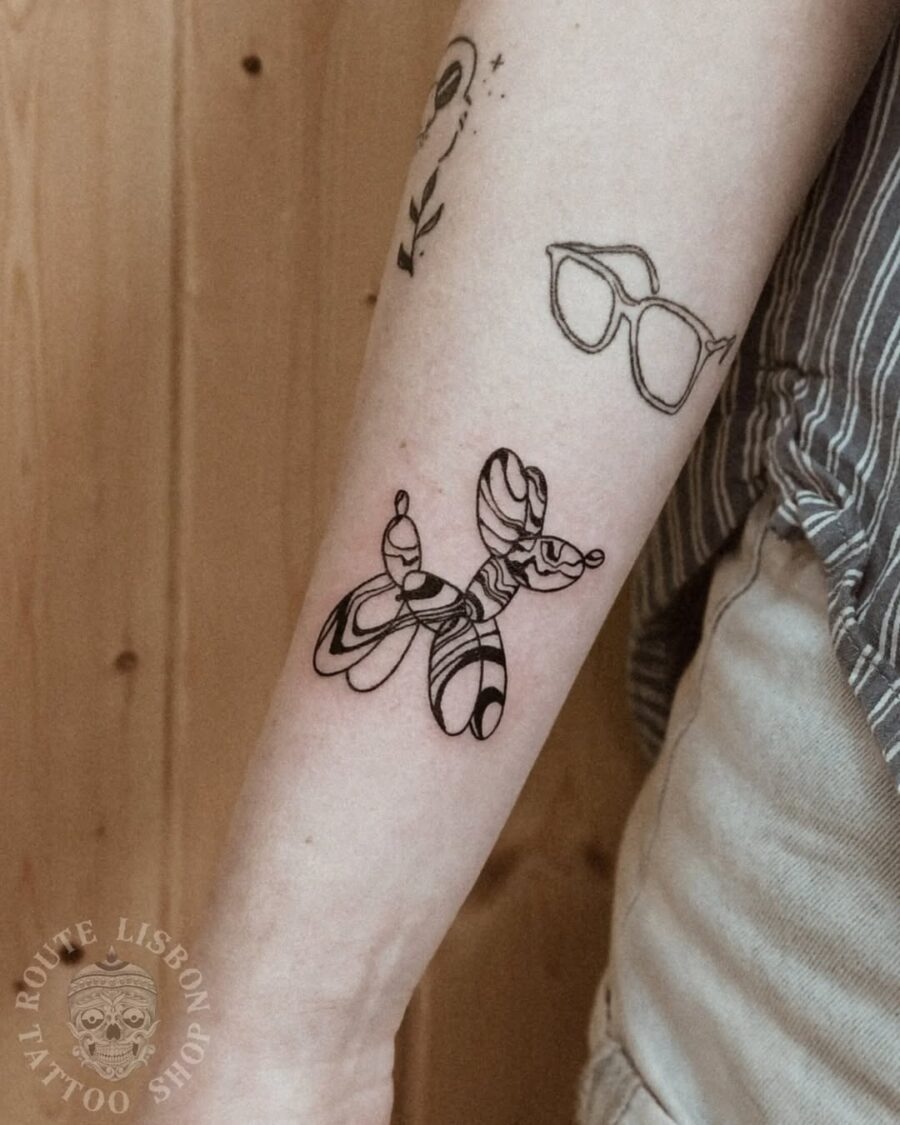 Whimsical balloon dog tattoo in minimalist style Tattoo on skin