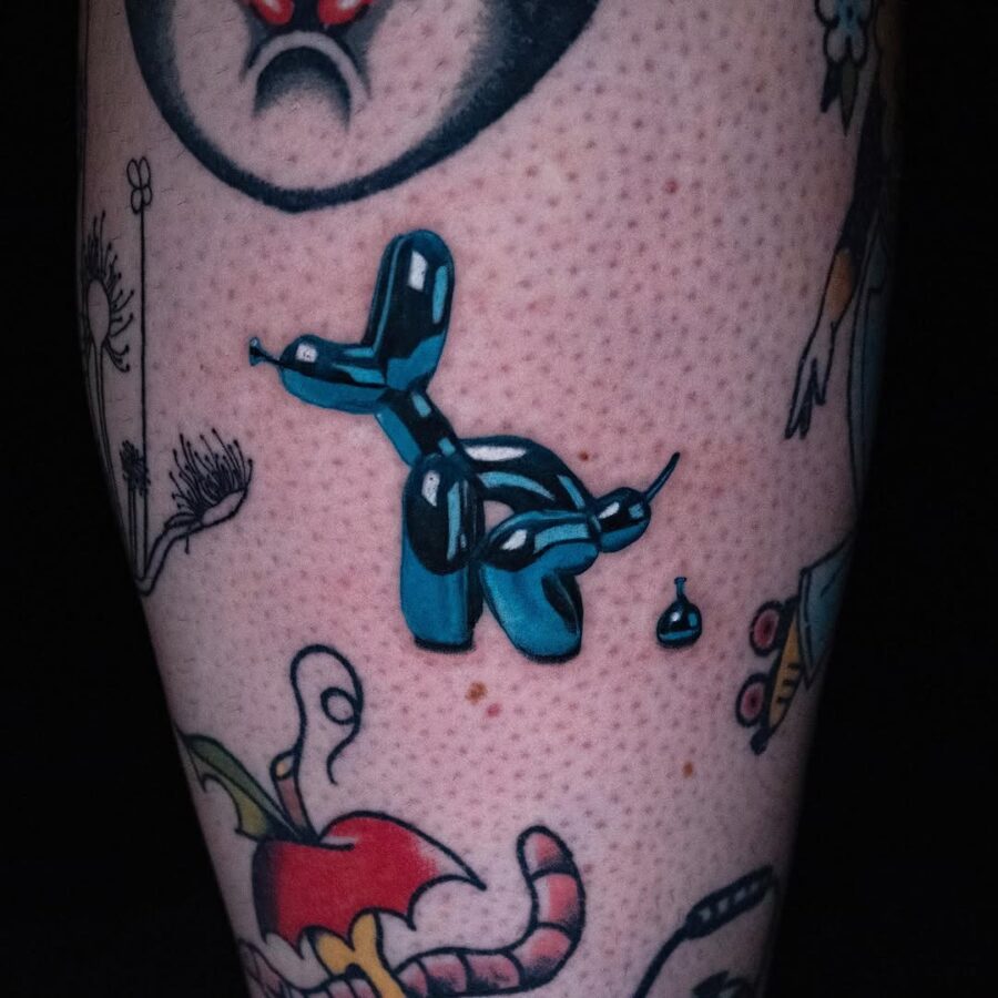 Whimsical balloon dog tattoo with vibrant colors Tattoo on skin