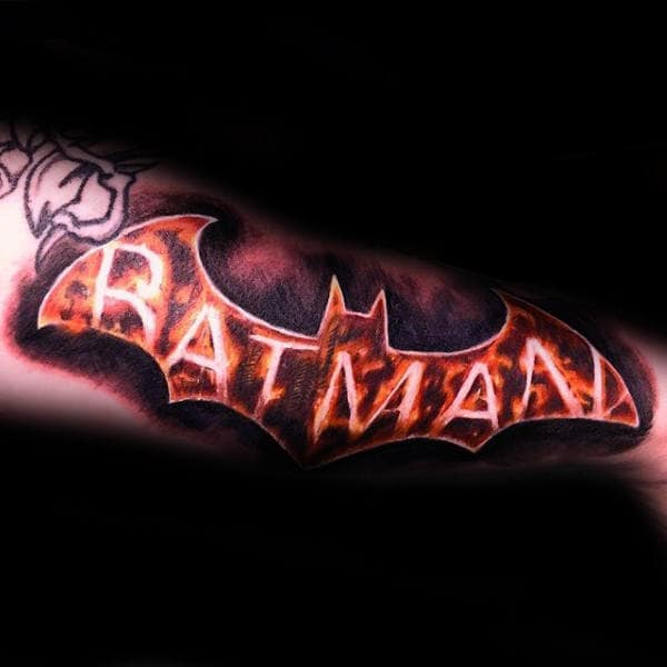 Batman Written in Fire Across the Logo Batman Tattoo Tattoo on skin