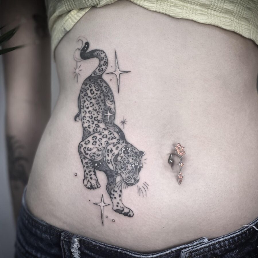 Bold Leopard Tattoo with Sparkling Stars Tattoo on skin