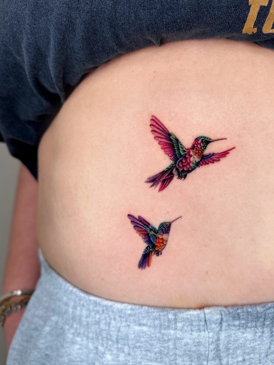 Colorful hummingbirds gracefully inked on skin Tattoo on skin