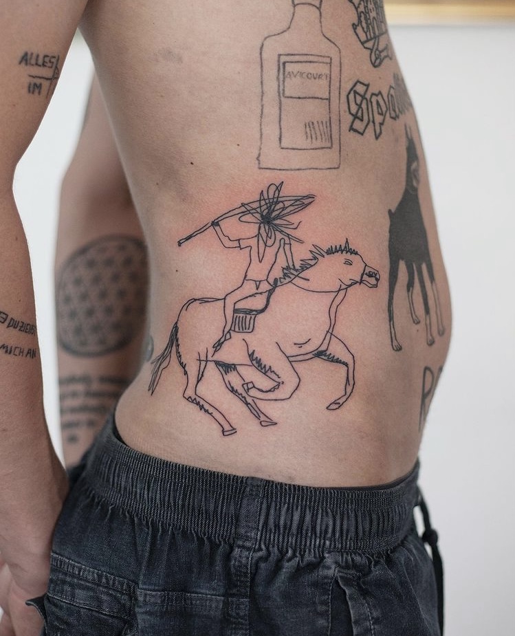Dynamic horseman tattoo on the belly Tattoo on skin