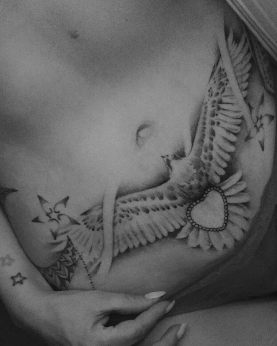 Elegant bird tattoo design on belly Tattoo on skin