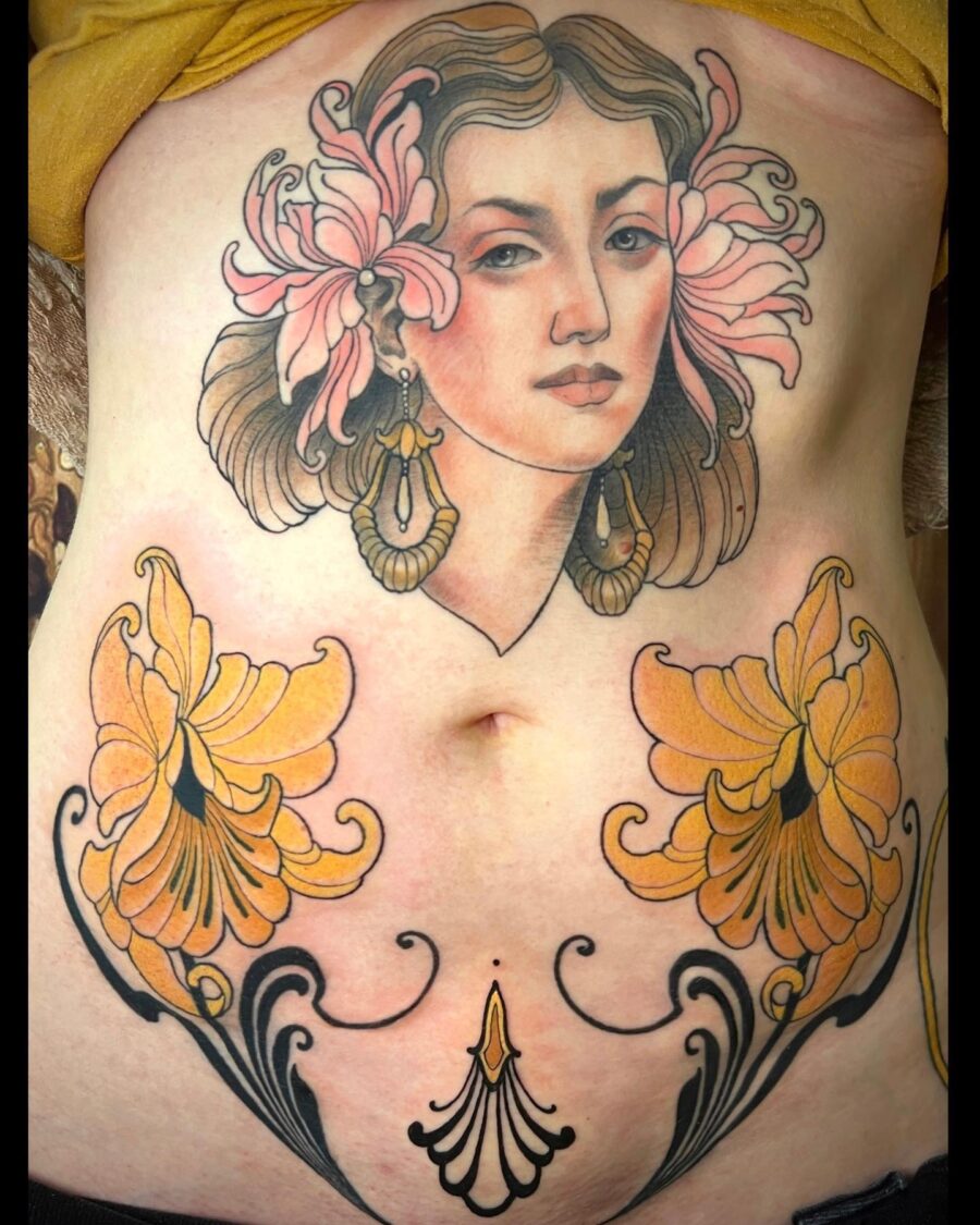 Elegant feminine belly tattoo featuring floral elements Tattoo on skin