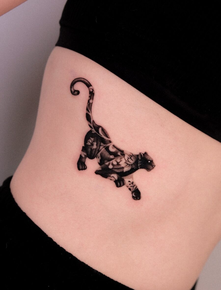 Elegant tiger tattoo capturing wild elegance Tattoo on skin