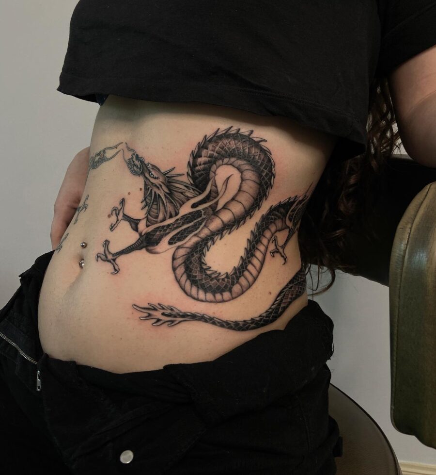 Intricate dragon belly tattoo showcases bold artistry Tattoo on skin