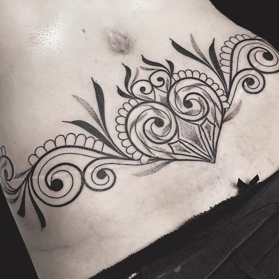 Intricate floral design on the belly Tattoo on skin