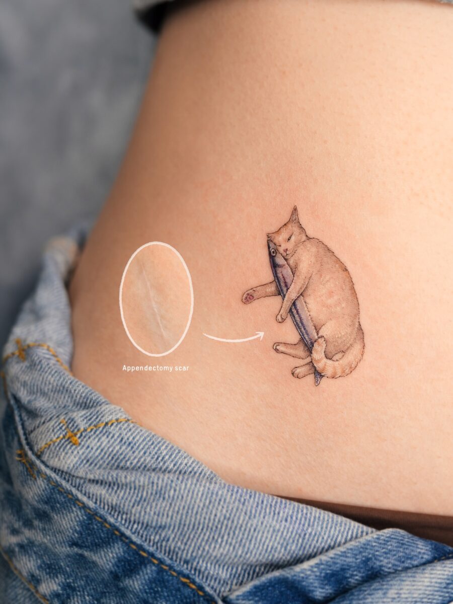 Playful cat tattoo near an appendectomy scar Tattoo on skin