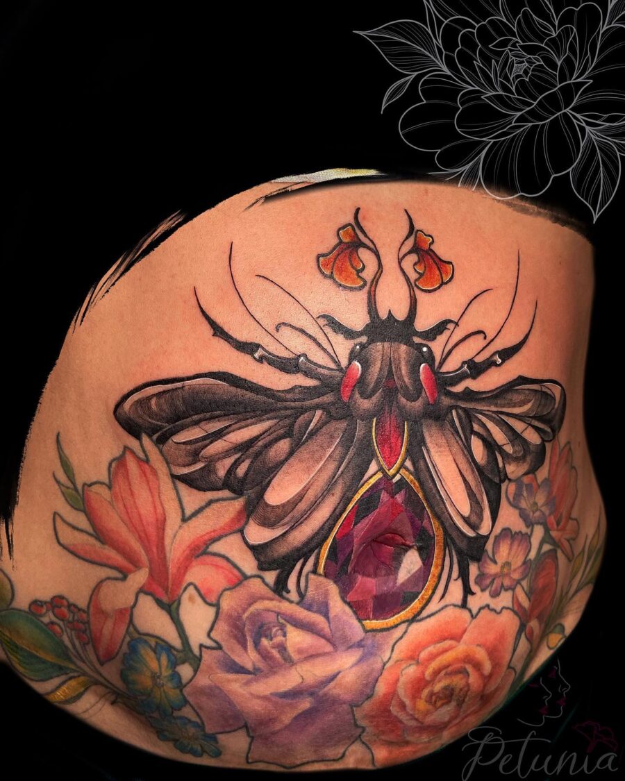 Stunning belly tattoo featuring a butterfly design Tattoo on skin