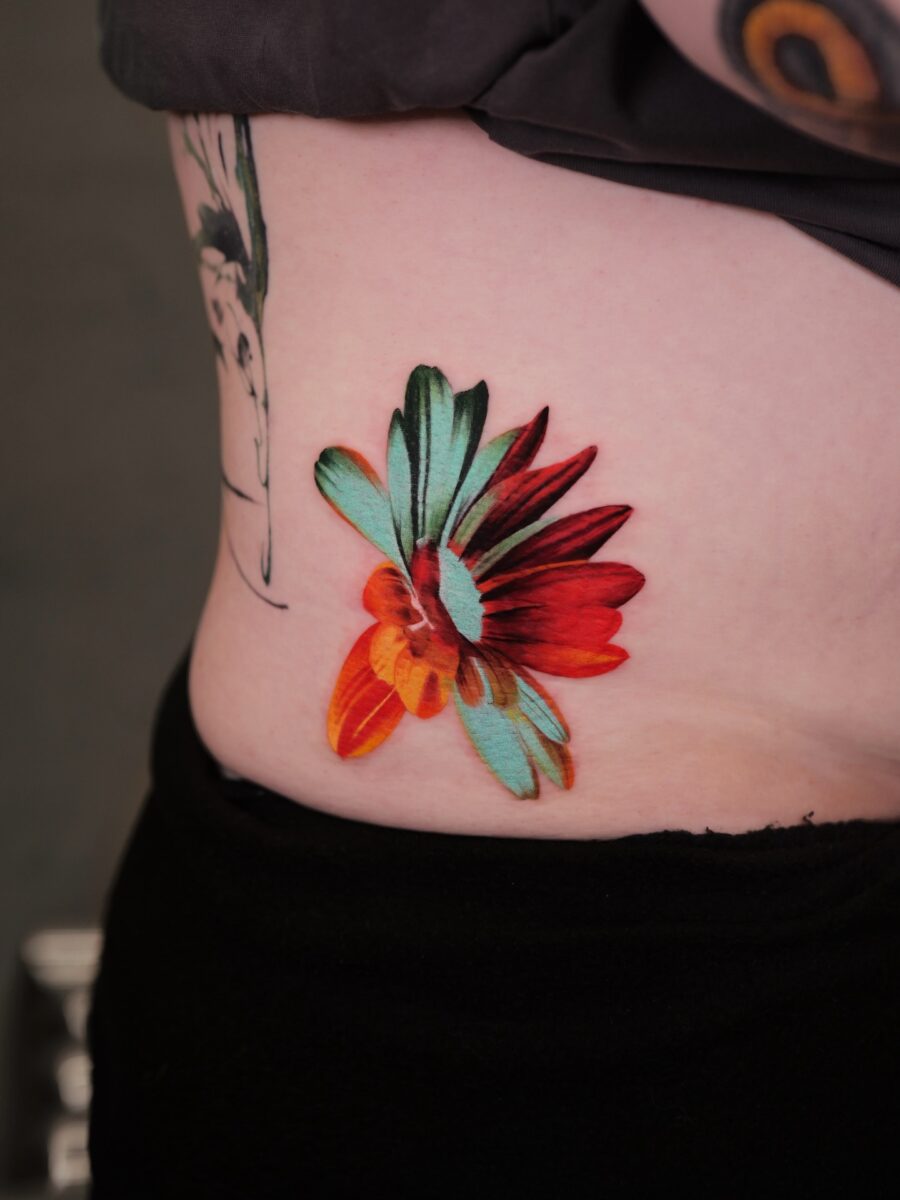 Stunning Floral Belly Tattoo in Vivid Colors Tattoo on skin