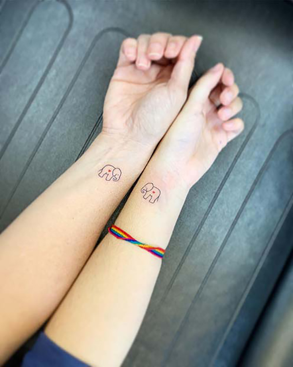 Elephants Never Forget Their Best Friends Tattoo on skin