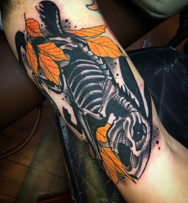 Rabbit Skeleton with Orange Leaves Inner Bicep Tattoo Ideas for Upper Arm Tattoo on skin